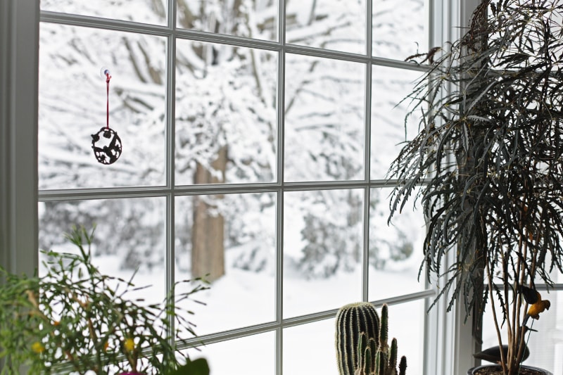 How Can I Lower My Heating Bill This Winter? Serene Winter Blizzard Bay Window.