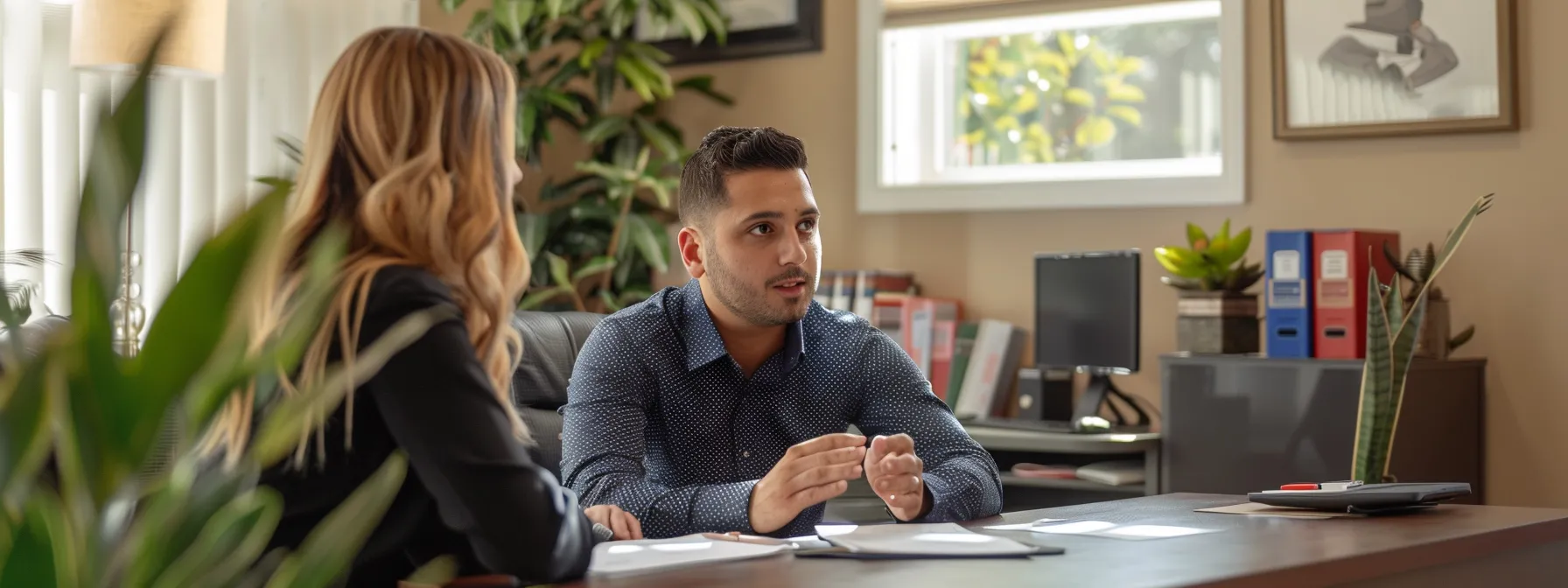 a focused and professional scene inside a modern office, featuring a homeowner intently discussing the terms of a duct cleaning service agreement with a knowledgeable representative, surrounded by clear documentation and a sleek desktop, emphasizing the importance of transparency and assurance in the service contract.