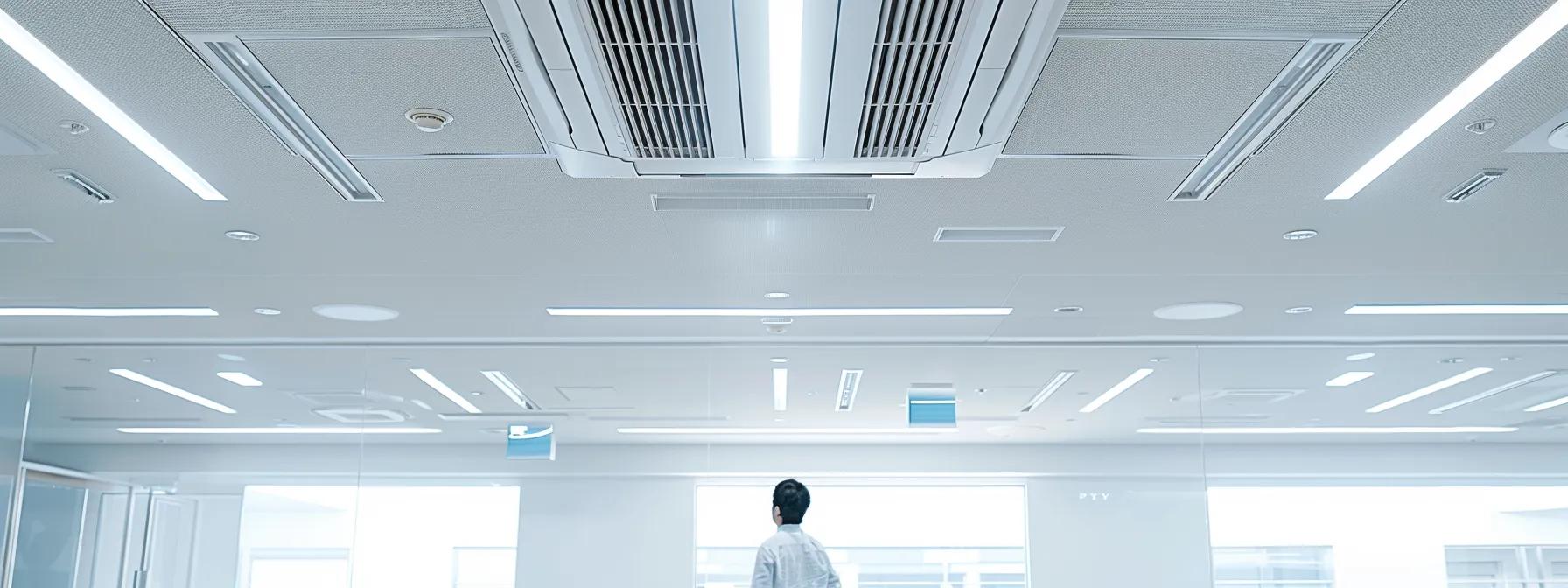 a sleek, modern office setting showcases a professional hvac technician inspecting a sophisticated air conditioning unit, illuminated by bright overhead lights that highlight the intricate details of the equipment.
