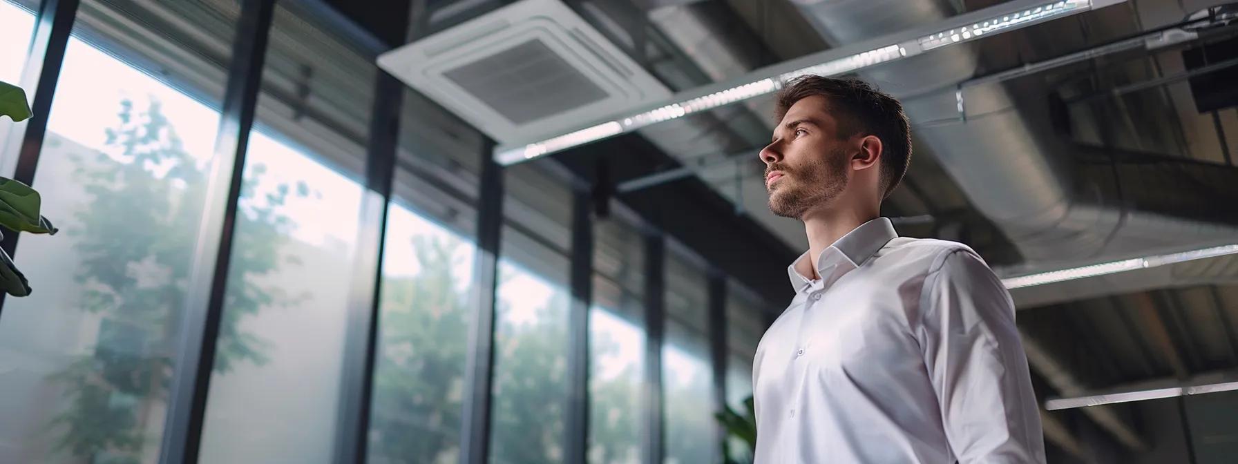 a professional hvac technician meticulously inspects and adjusts a sophisticated hvac system inside a modern office environment, highlighting the importance of compliance with local codes and regulations.